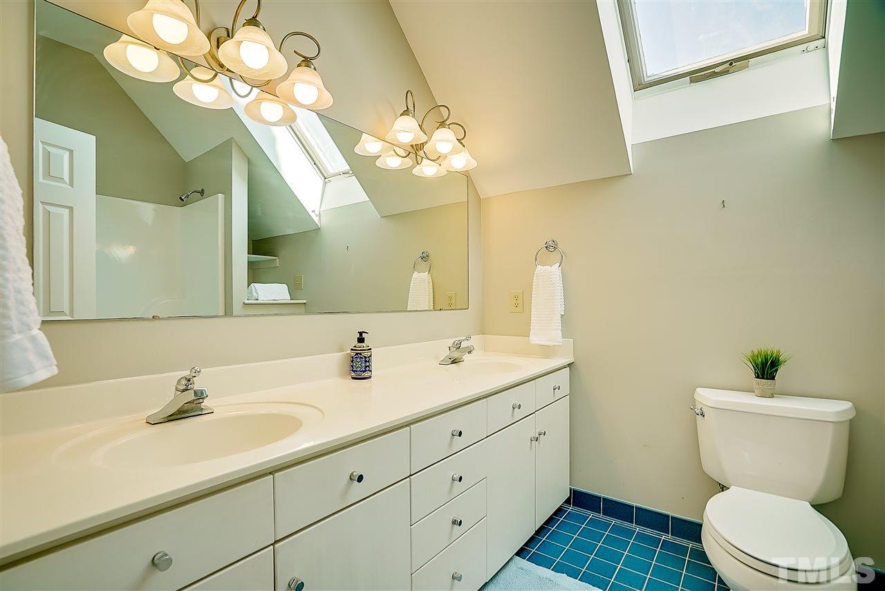 1325 Farmview Road Hillsborough, NC 27278 - Photo 17 of 25 a bathroom with a toilet sink and mirror