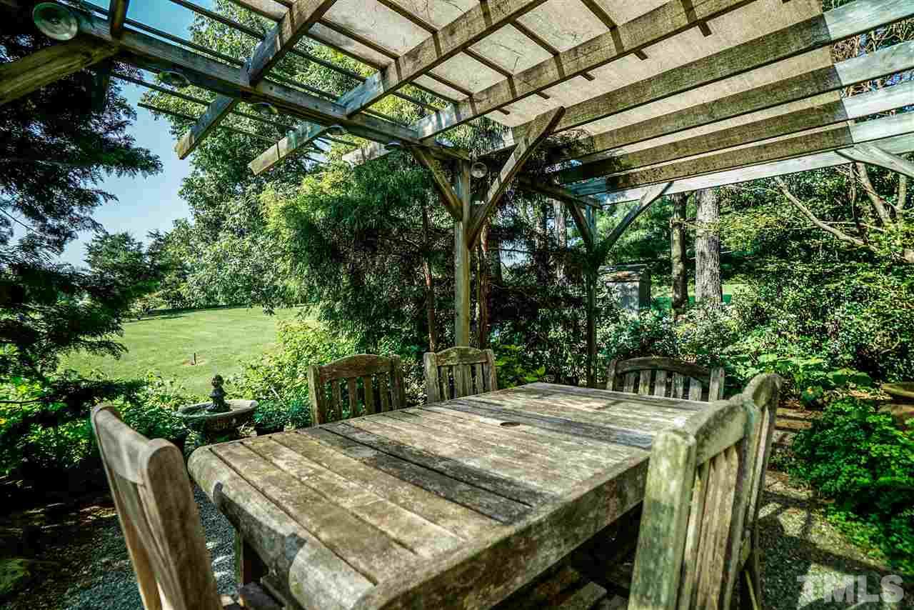 1325 Farmview Road Hillsborough, NC 27278 - Photo 23 of 25 a view of a backyard with furniture and a backyard