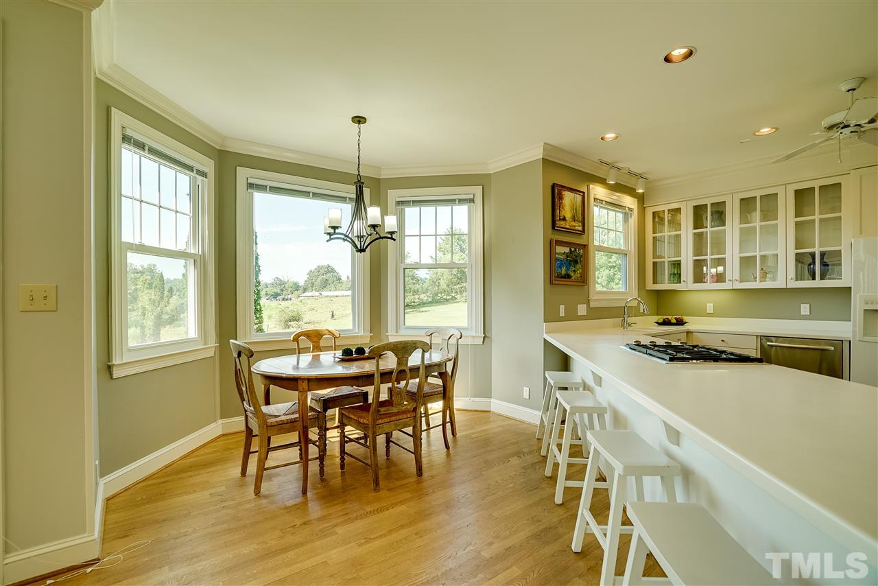 1325 Farmview Road Hillsborough, NC 27278 - Photo 9 of 25 a view of a dining room with furniture window and outside view