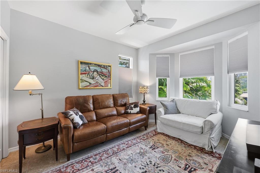 2958 Poplar Street Naples, FL 34112 - Photo 16 of 49 a living room with furniture and a window