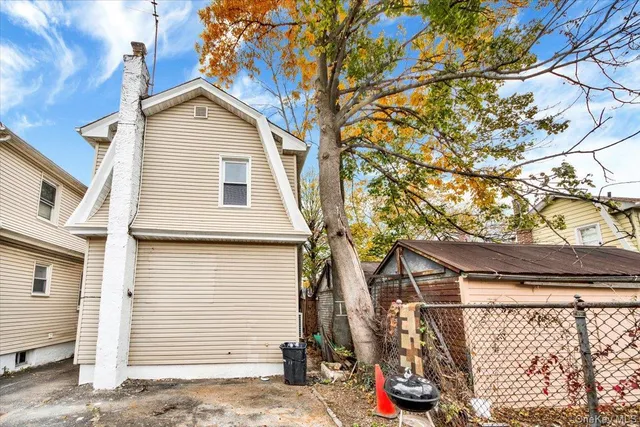 a view of a house with a tree