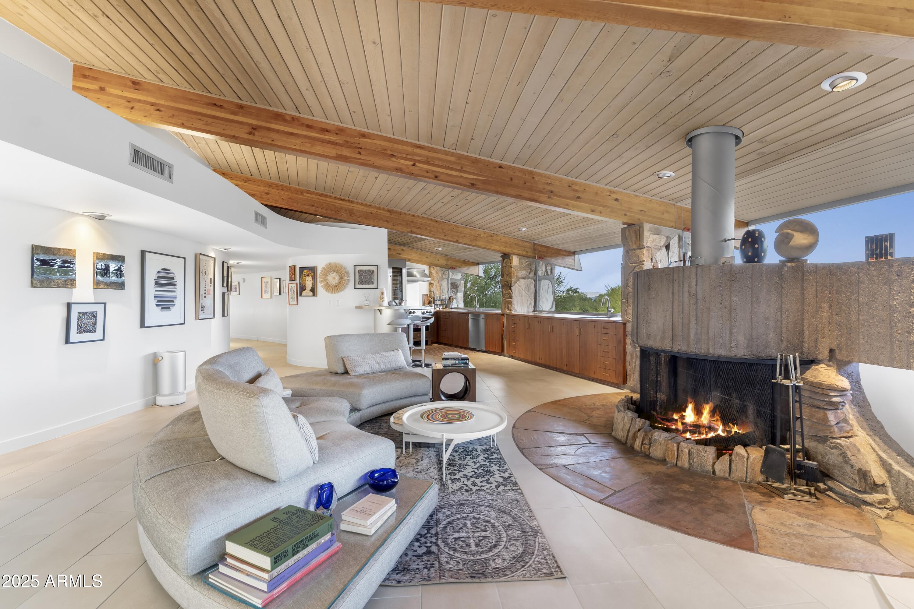 7915 East Primrose Path Carefree, AZ 85377 - Photo 10 of 55 a living room with furniture and a fireplace