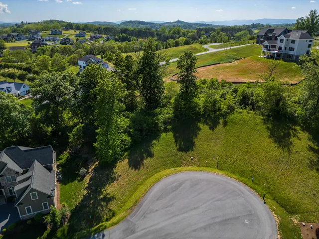 an aerial view of ocean residential house with outdoor space and trees around