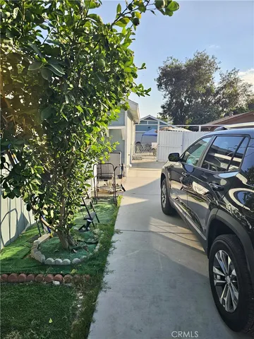 a view of a car parked in a yard