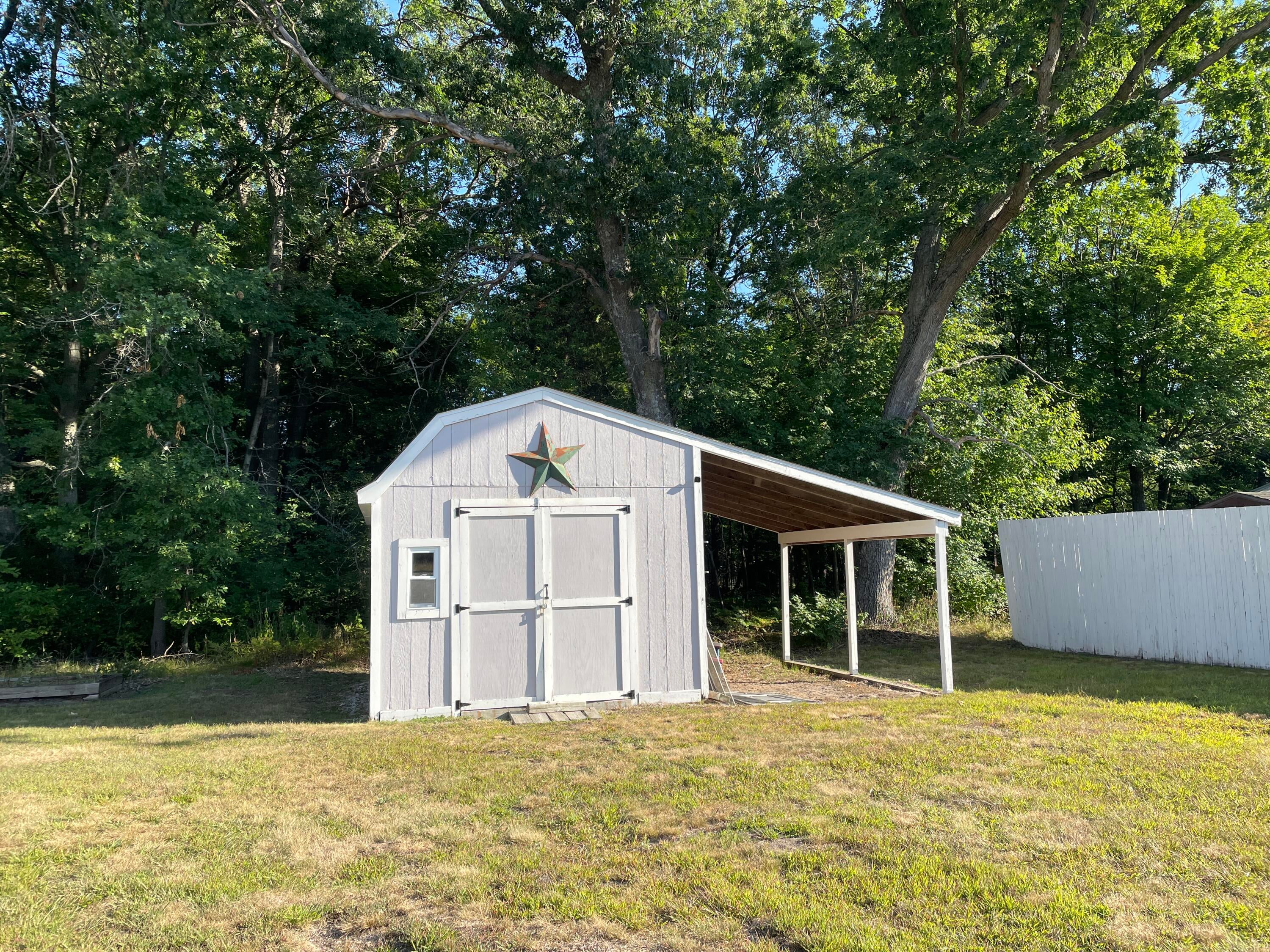 8527 Artesia Beach Road St. Helen, MI 48656 - Photo 22 of 29 Large shed with loft and lean-to