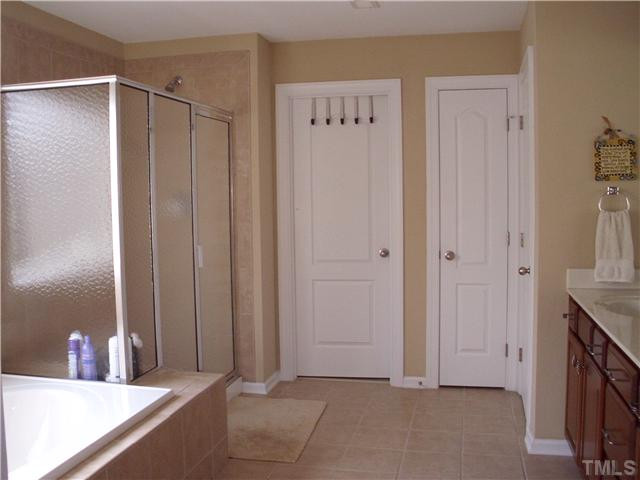 5802 St Agnes Way Raleigh, NC 27612 - Photo 13 of 25 Neutral tones with separate large shower and garden tub, dual sinks. Master Bath/Spa