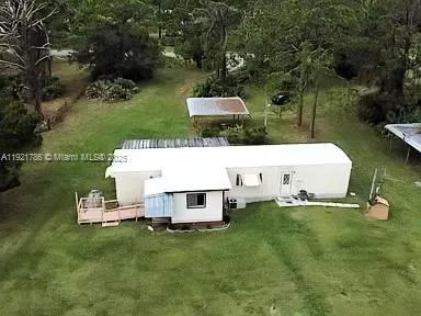 a view of a yard with swimming pool
