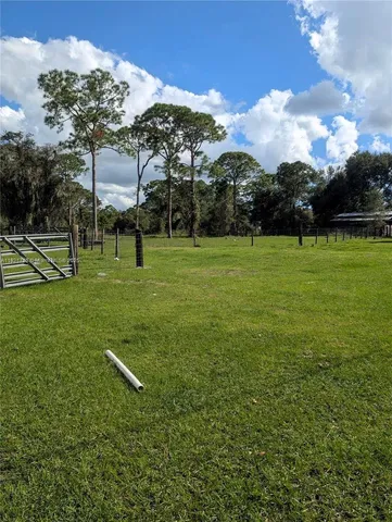 an aerial view of residential house with outdoor space