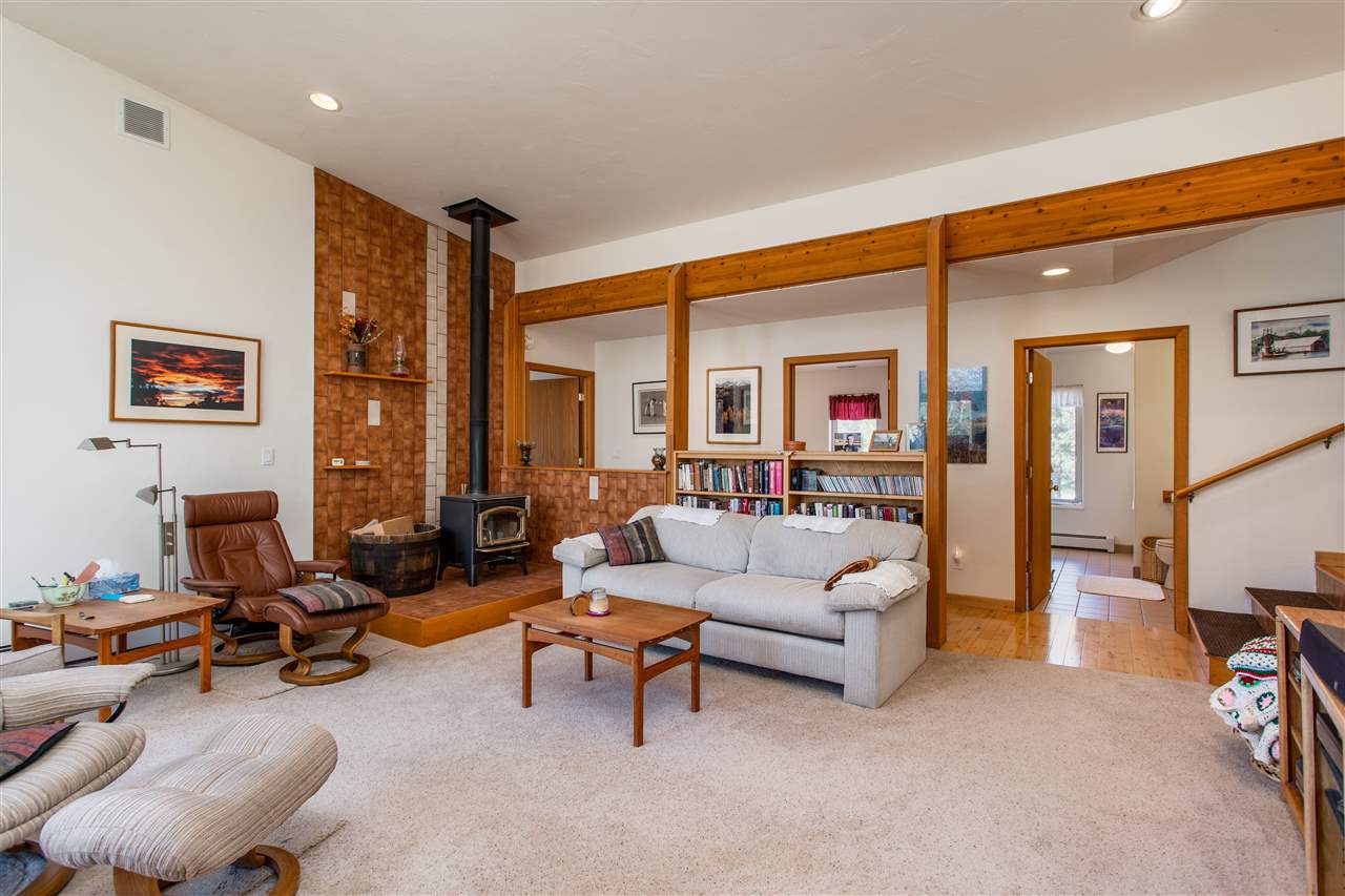 18735 Northridge Road Cedaredge, CO 81413 - Photo 14 of 26 a living room with furniture a rug and a large window
