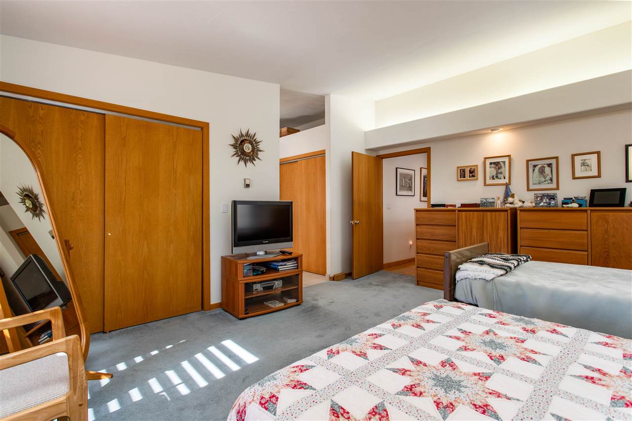 18735 Northridge Road Cedaredge, CO 81413 - Photo 17 of 26 a bedroom with a bed and furniture