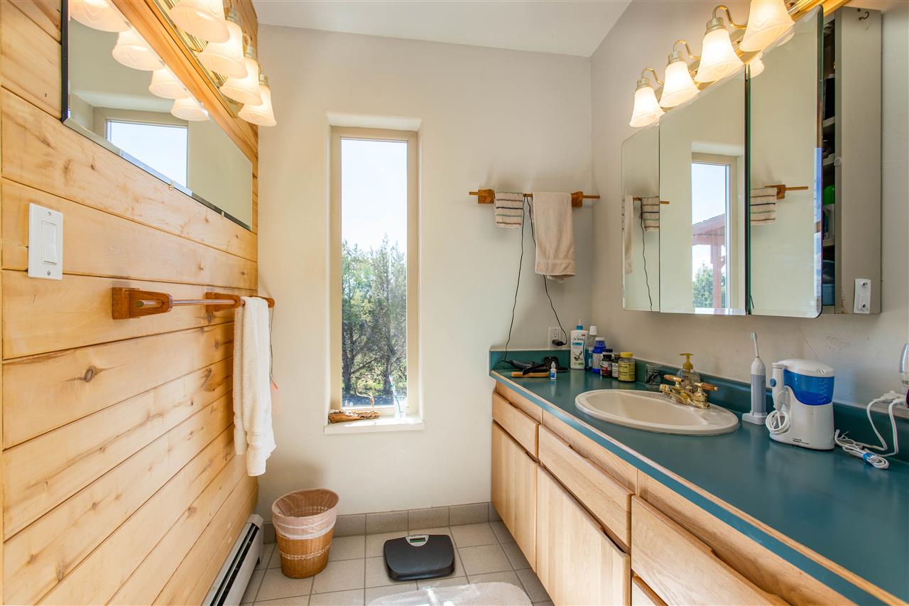 18735 Northridge Road Cedaredge, CO 81413 - Photo 22 of 26 a bathroom with a sink a toilet and a mirror