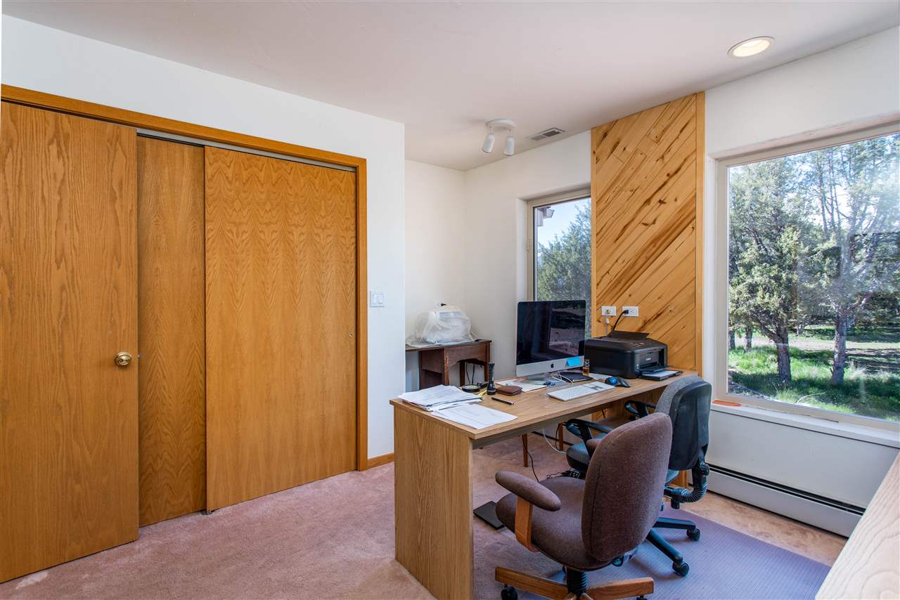 18735 Northridge Road Cedaredge, CO 81413 - Photo 24 of 26 a room with furniture a window and a view of balcony