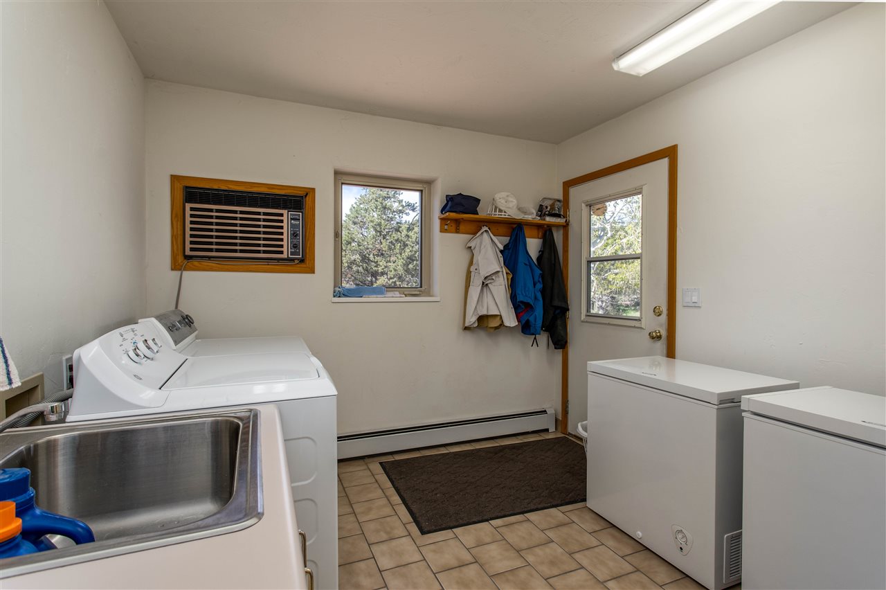 18735 Northridge Road Cedaredge, CO 81413 - Photo 26 of 26 a utility room with dryer and washer