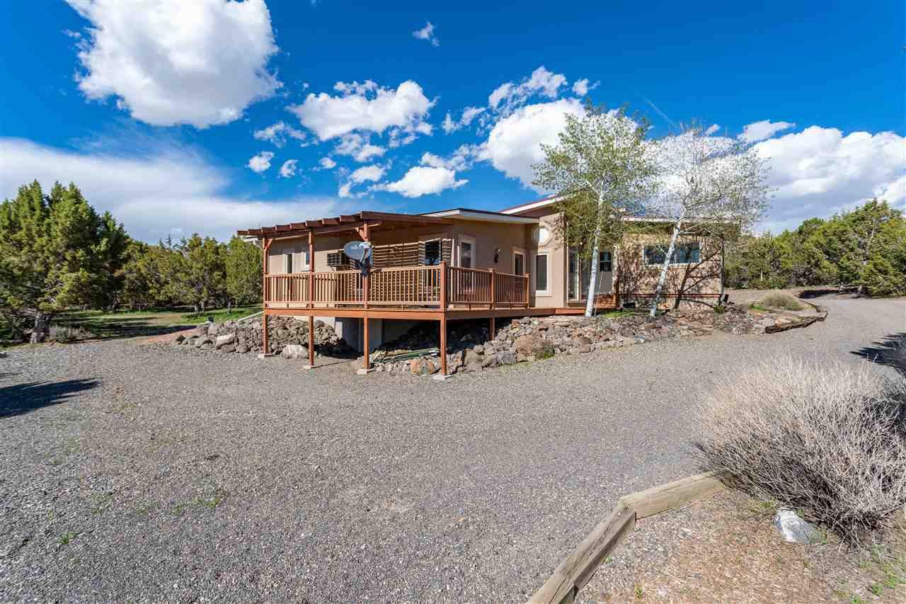 18735 Northridge Road Cedaredge, CO 81413 - Photo 5 of 26 a view of a house with a yard