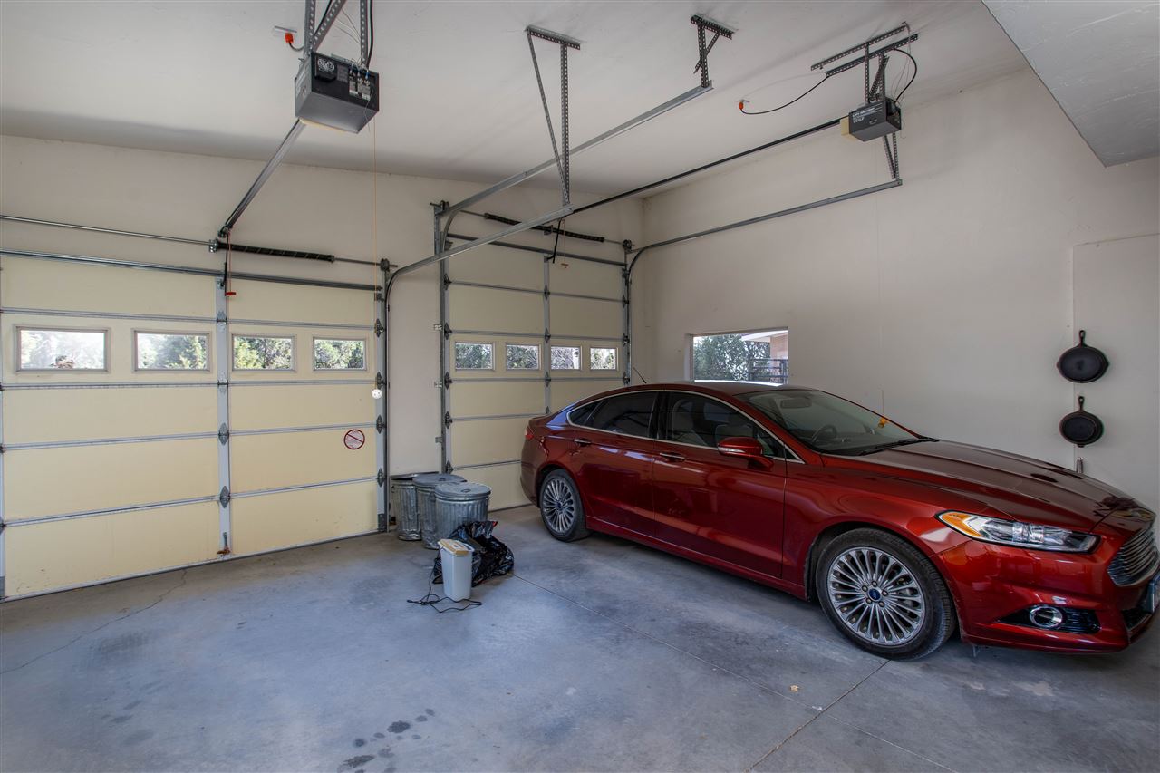 18735 Northridge Road Cedaredge, CO 81413 - Photo 7 of 26 a car is parked in a garage