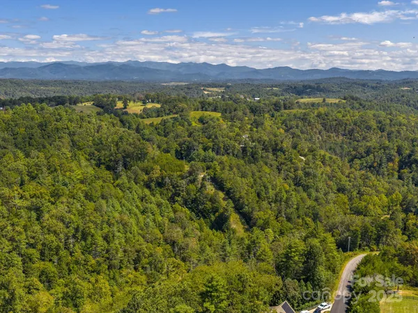 a view of a house with a yard porch and sitting area