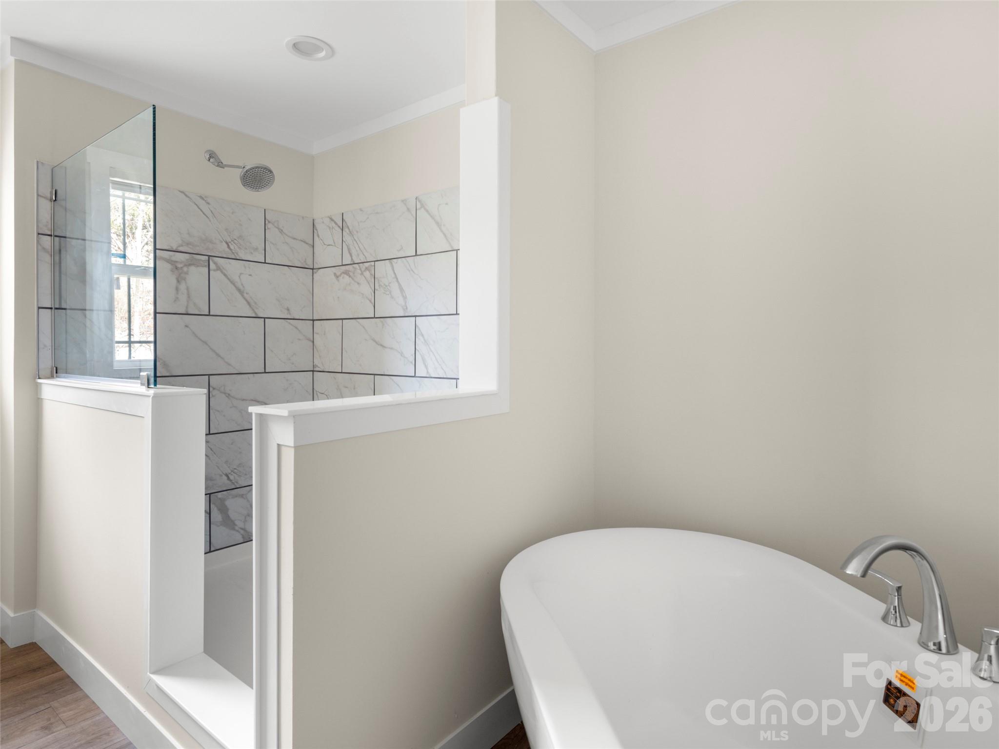 2095 Emmas Grove Road Fairview, NC 28730 - Photo 15 of 24 a bathroom with a bathtub and shower