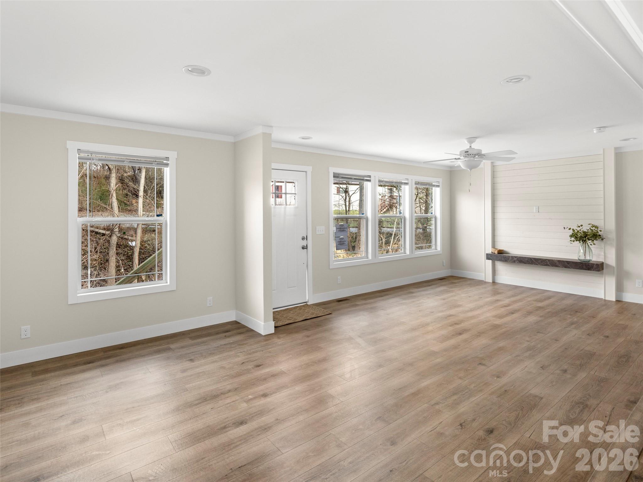 2095 Emmas Grove Road Fairview, NC 28730 - Photo 4 of 24 an empty room with windows and closet