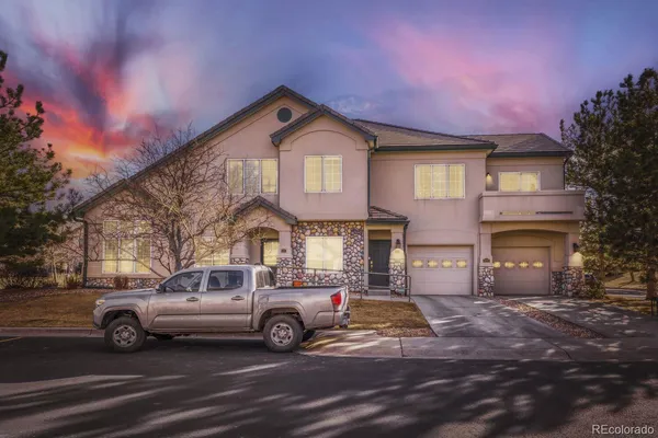 a view of a car parked in front of a house