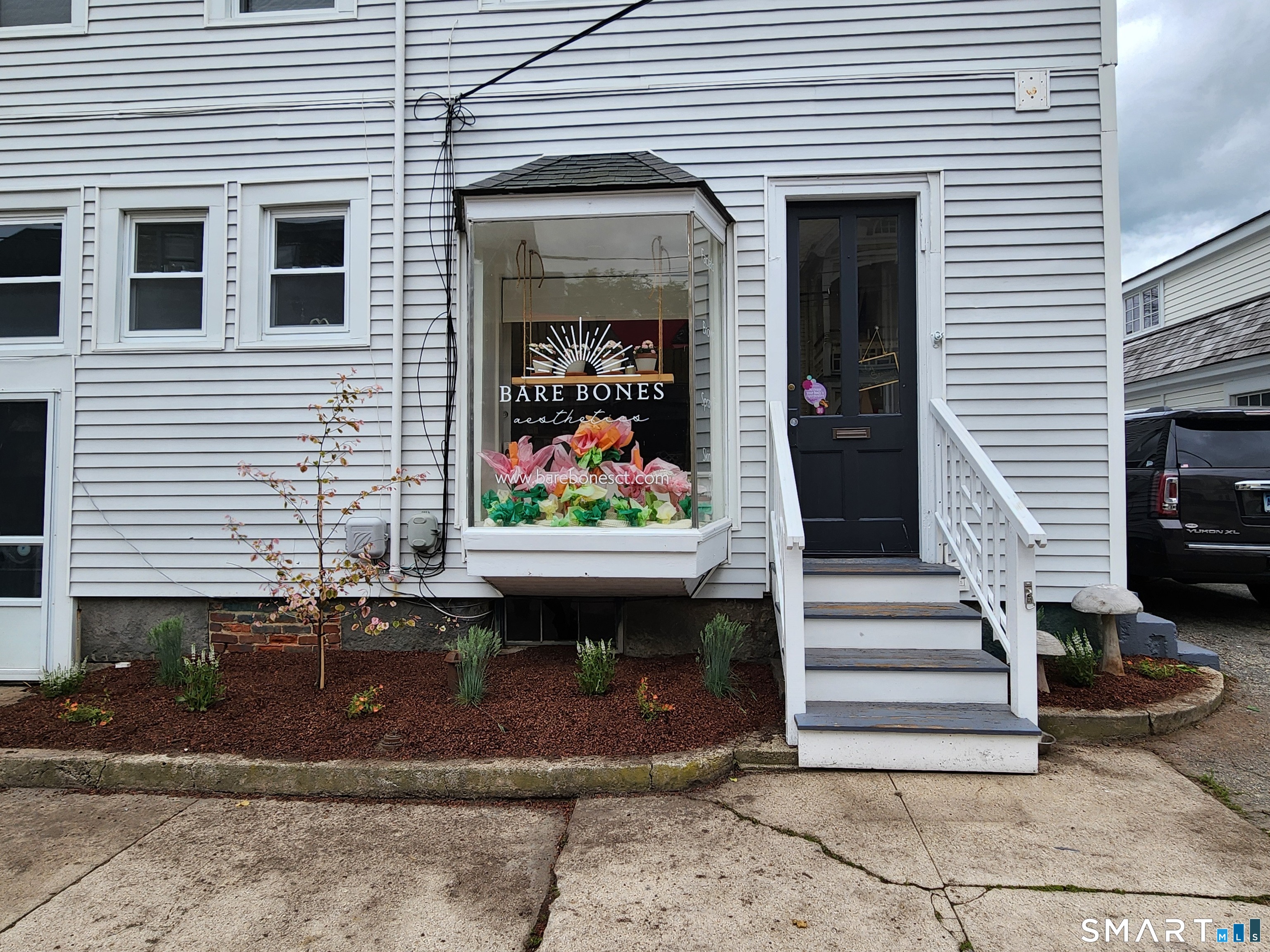 117 Water Street Stonington, CT 06378 - Photo 12 of 40 a front view of a house with a porch