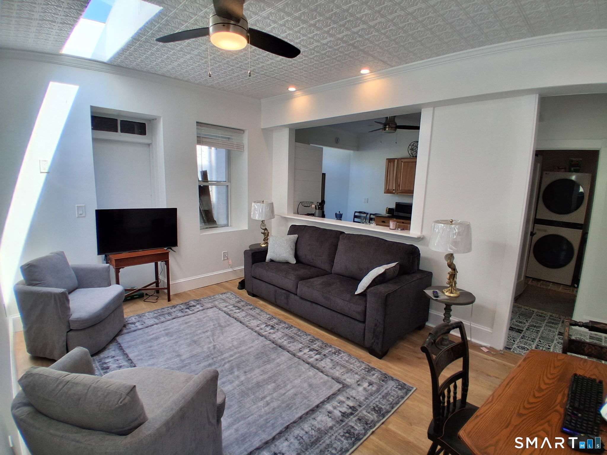 117 Water Street Stonington, CT 06378 - Photo 14 of 40 a living room with furniture and a flat screen tv