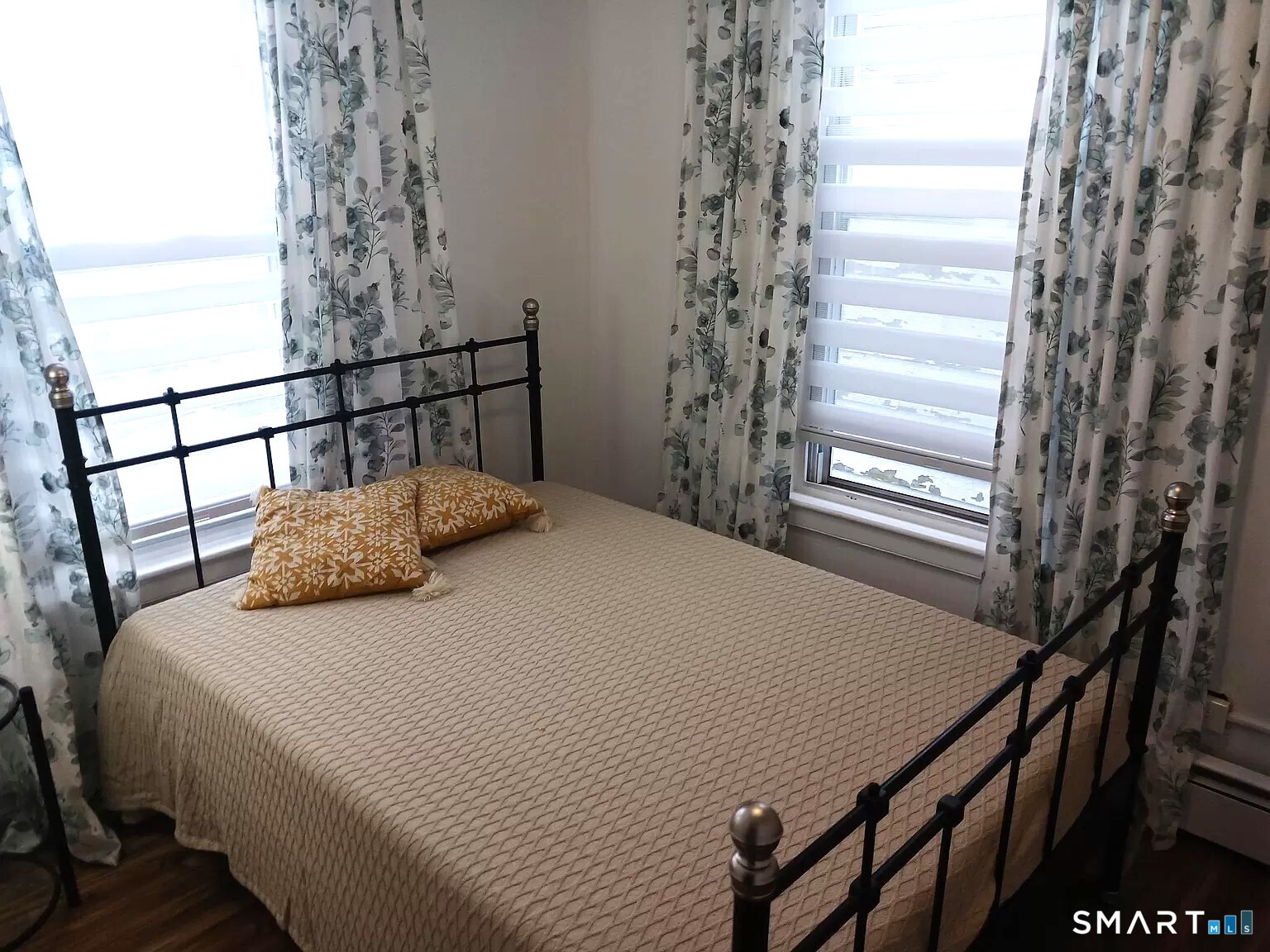 117 Water Street Stonington, CT 06378 - Photo 18 of 40 a bedroom with a bed and a window