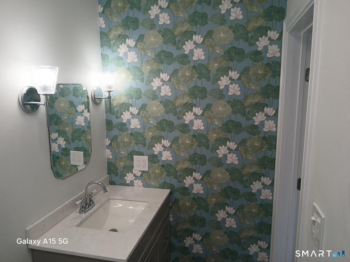 117 Water Street Stonington, CT 06378 - Photo 26 of 40 a bathroom with a sink and mirror