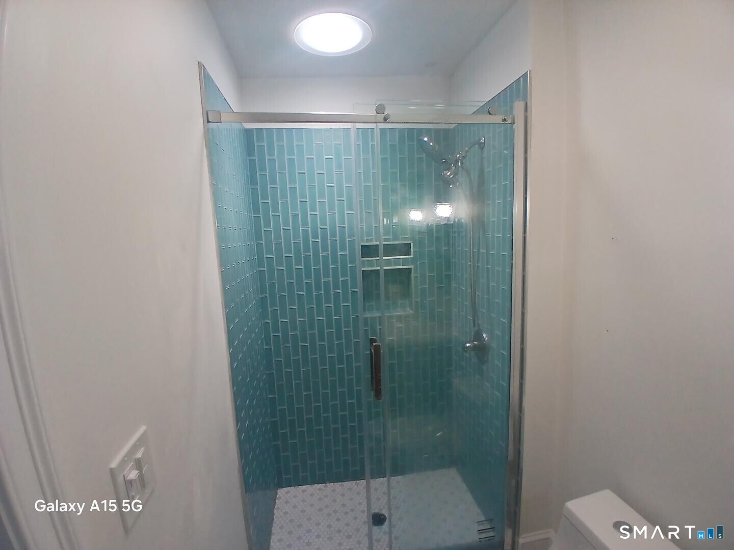 117 Water Street Stonington, CT 06378 - Photo 27 of 40 a bathroom with a shower and toilet