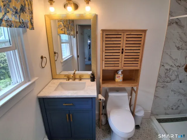 a kitchen with stainless steel appliances granite countertop a refrigerator stove and microwave