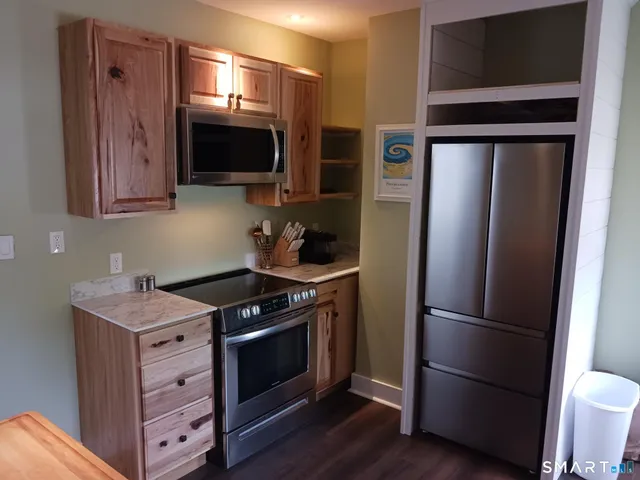 a view of a kitchen with washer and dryer