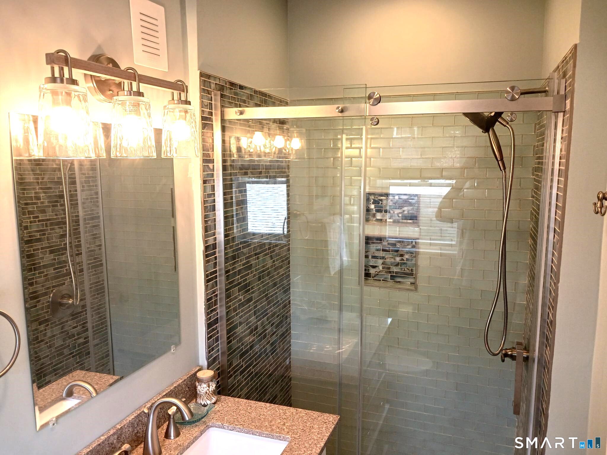 117 Water Street Stonington, CT 06378 - Photo 40 of 40 a bathroom with a shower and a sink