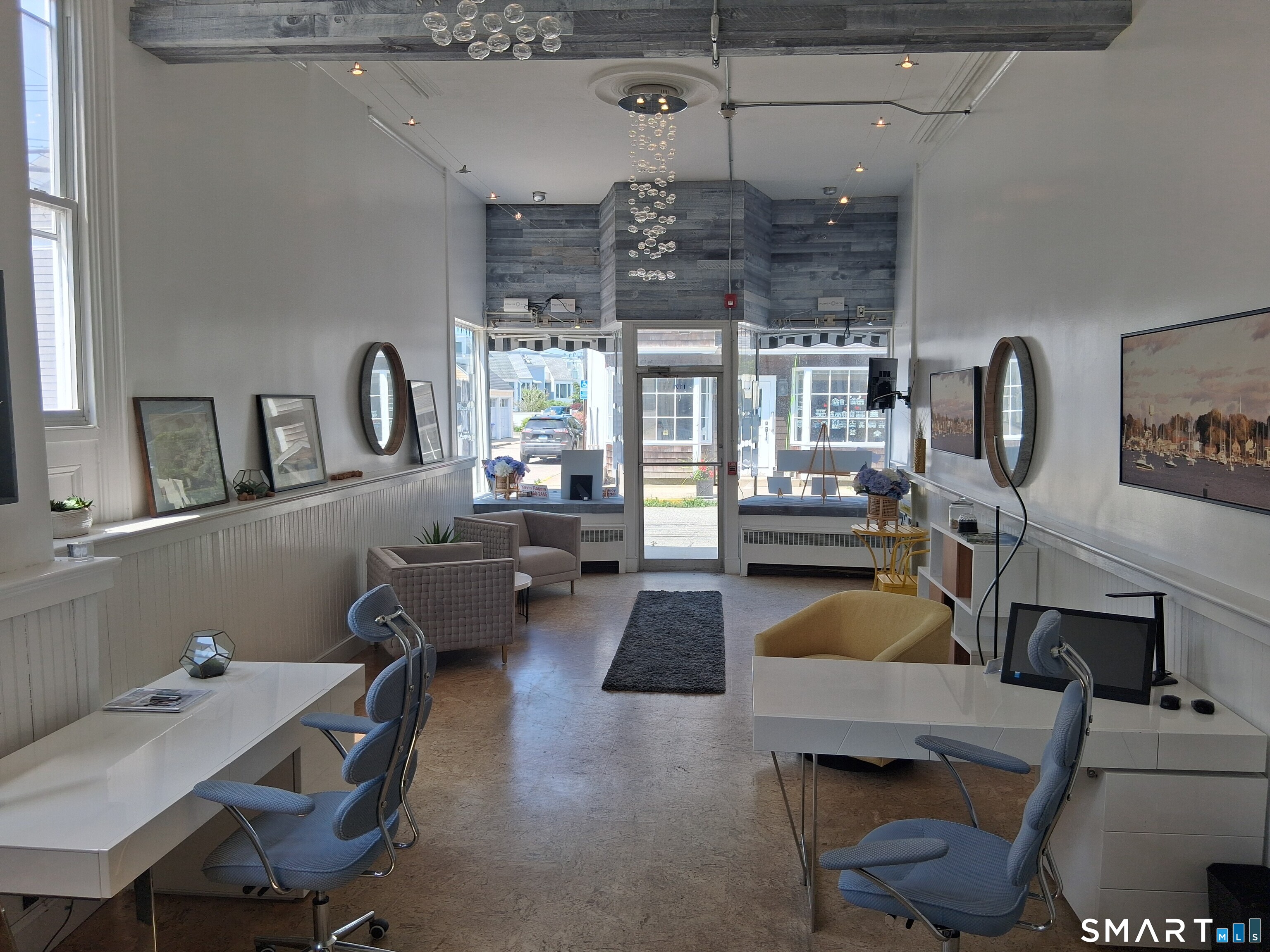 117 Water Street Stonington, CT 06378 - Photo 6 of 40 a living room with furniture and a chandelier