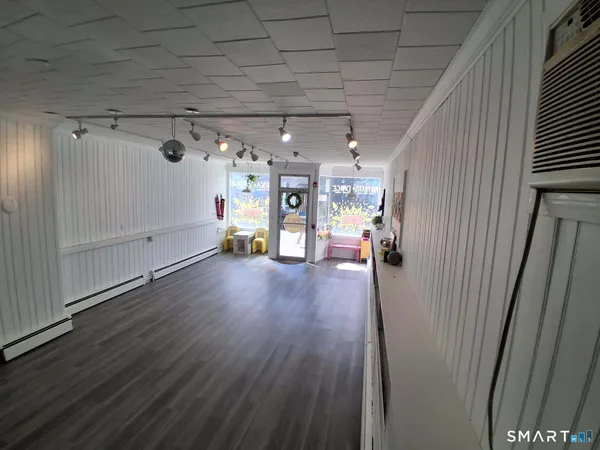 a view of a livingroom with wooden floor