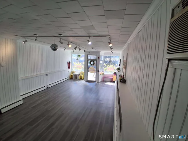 a view of a livingroom with wooden floor