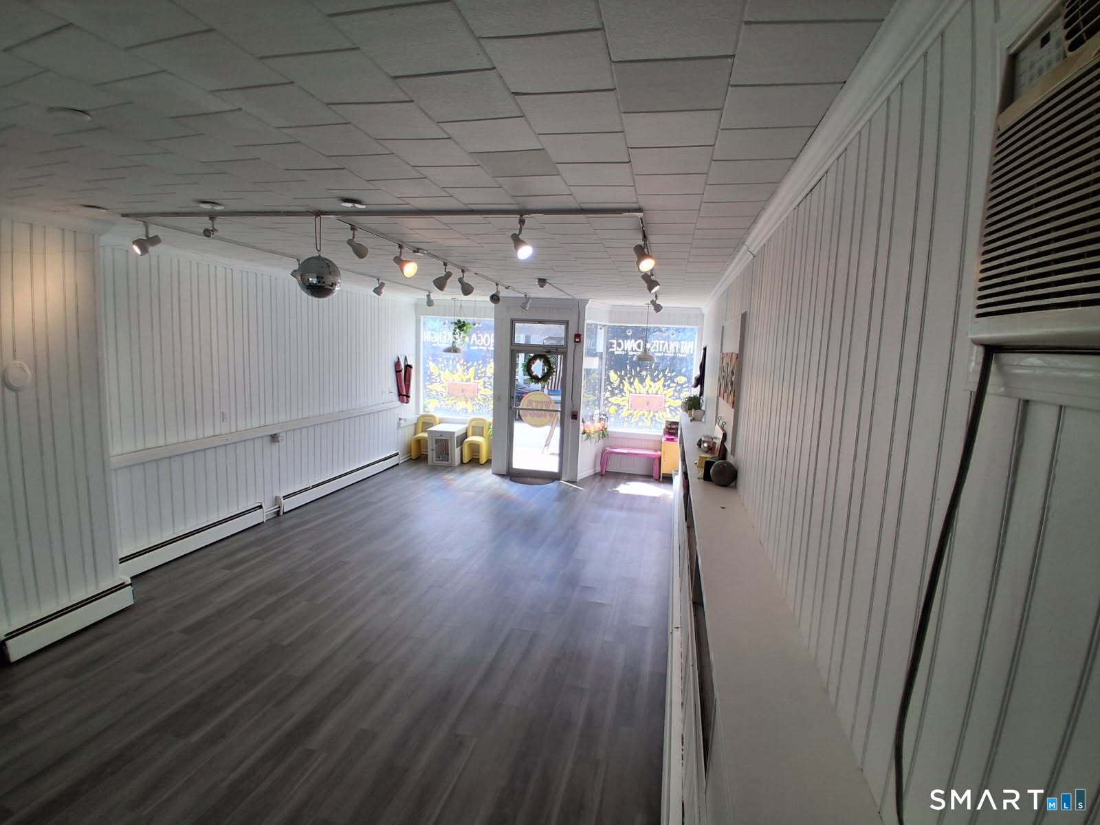 117 Water Street Stonington, CT 06378 - Photo 9 of 40 a view of a livingroom with wooden floor