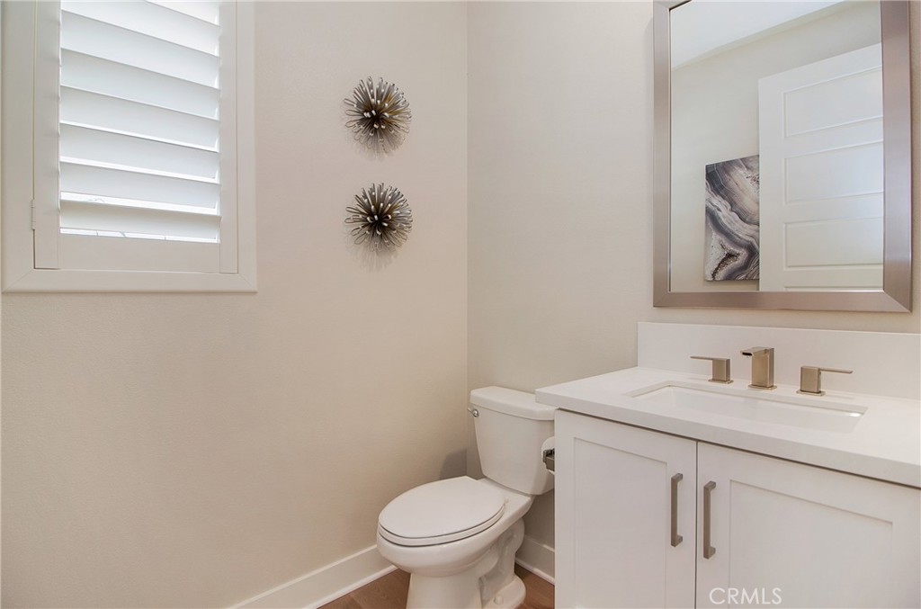 57 Sagan Way Irvine, CA 92618 - Photo 14 of 40 a bathroom with a toilet sink and mirror
