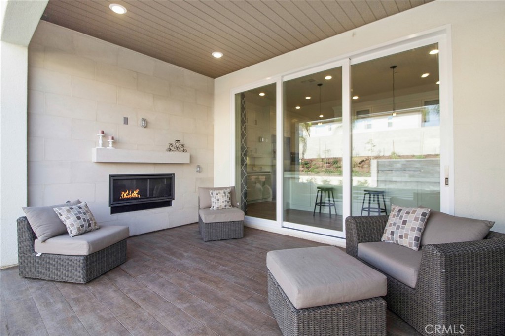 57 Sagan Way Irvine, CA 92618 - Photo 15 of 40 a living room with furniture and a fireplace