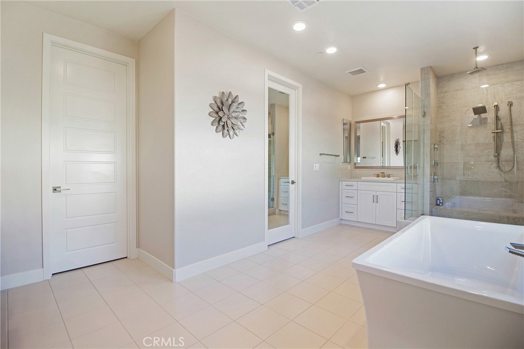 57 Sagan Way Irvine, CA 92618 - Photo 19 of 40 a bathroom with a sink a toilet and shower