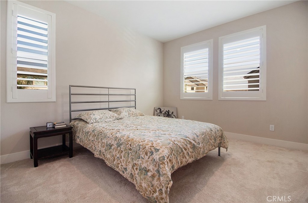 57 Sagan Way Irvine, CA 92618 - Photo 21 of 40 a bedroom with a bed and a window