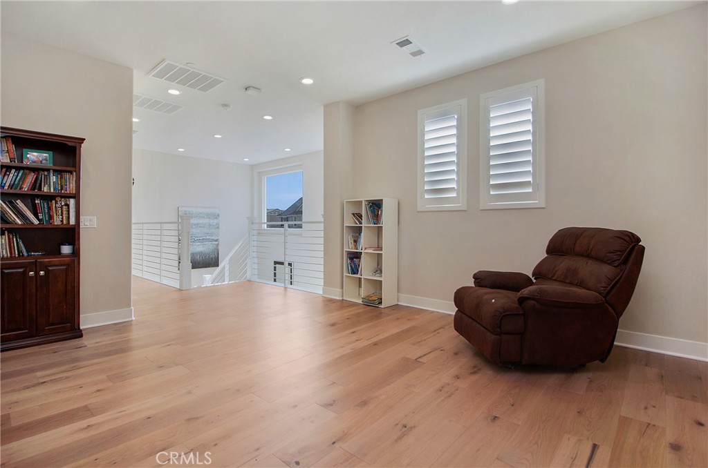 57 Sagan Way Irvine, CA 92618 - Photo 27 of 40 a living room with furniture and a wooden floor