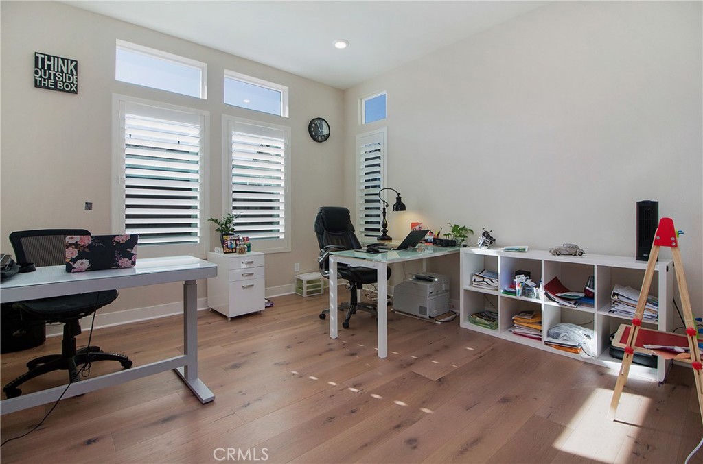 57 Sagan Way Irvine, CA 92618 - Photo 28 of 40 a view of a workspace with furniture and a bookshelf