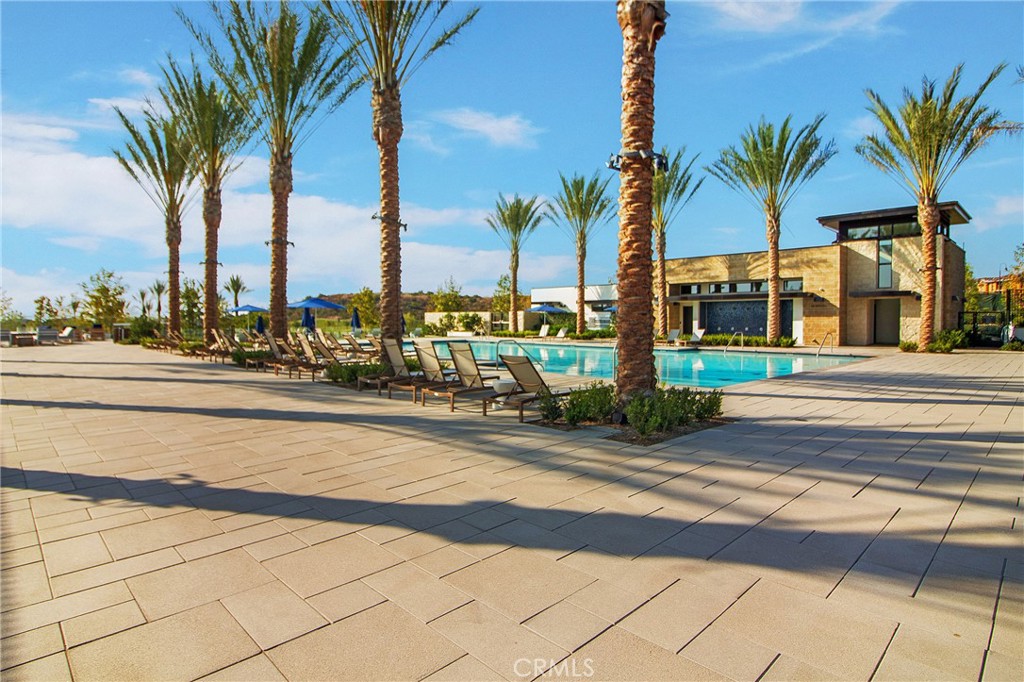 57 Sagan Way Irvine, CA 92618 - Photo 32 of 40 a view of a palm tree with flower on side of a house