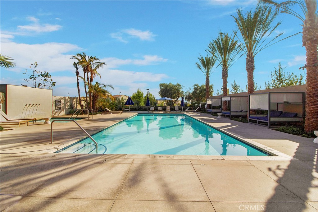 57 Sagan Way Irvine, CA 92618 - Photo 37 of 40 a view of a swimming pool with a lounge chairs