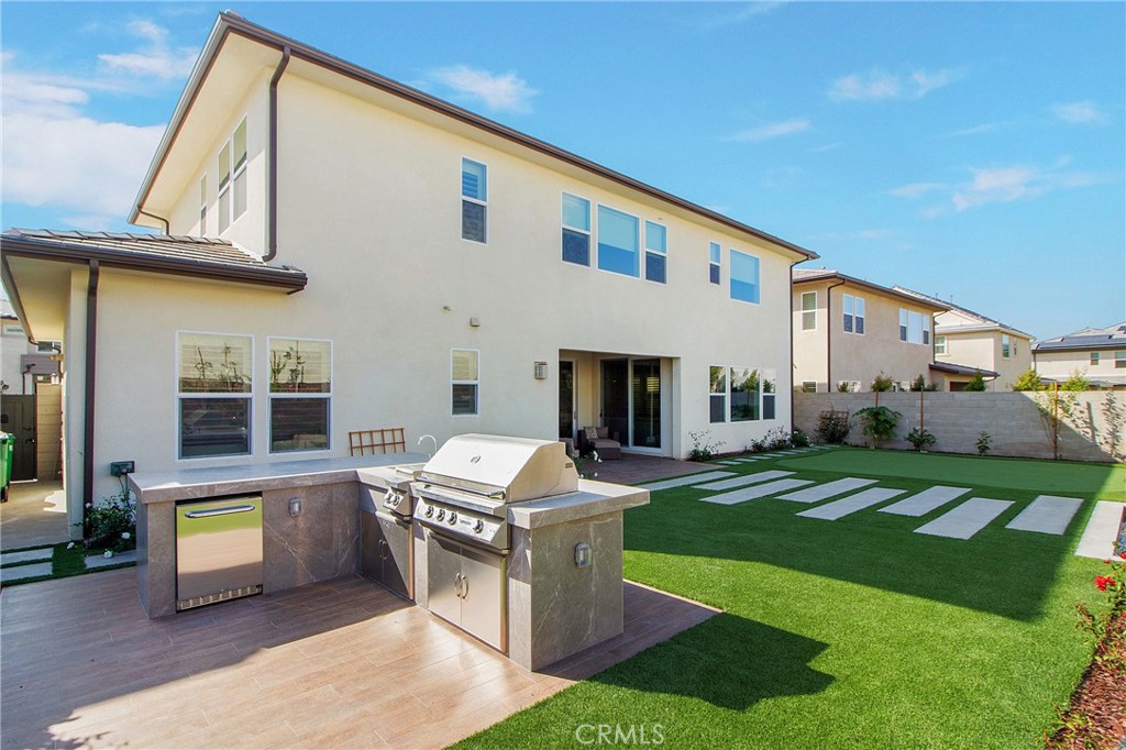 57 Sagan Way Irvine, CA 92618 - Photo 4 of 40 a front view of a house with a garden