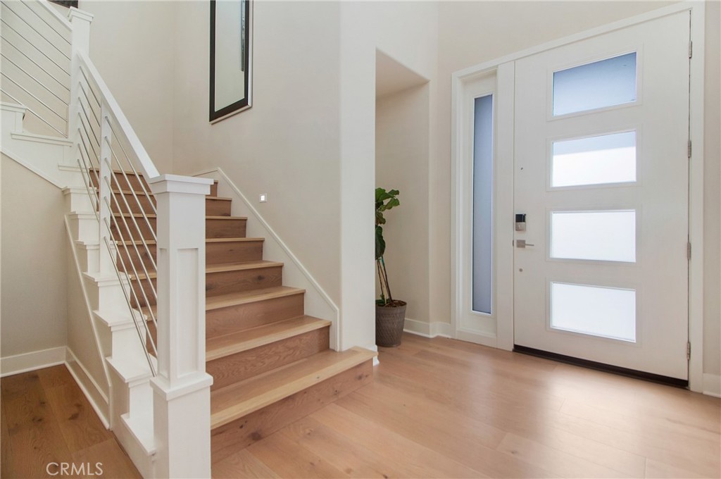 57 Sagan Way Irvine, CA 92618 - Photo 5 of 40 a view of staircase with white walls and windows
