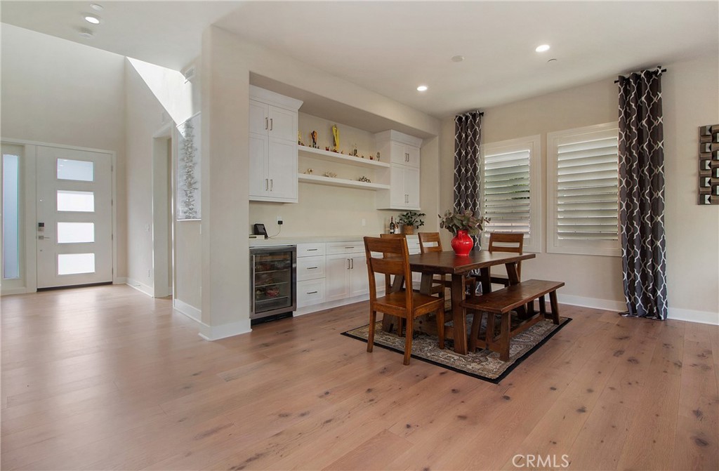57 Sagan Way Irvine, CA 92618 - Photo 6 of 40 a dining room with furniture and wooden floor