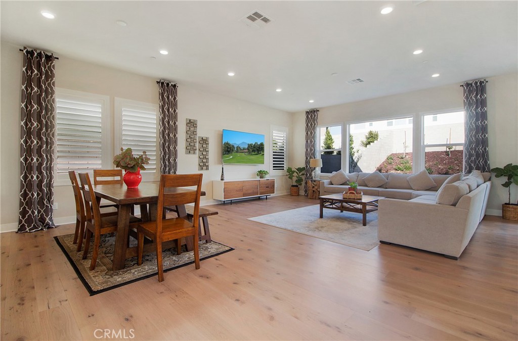 57 Sagan Way Irvine, CA 92618 - Photo 7 of 40 a living room with furniture and wooden floor