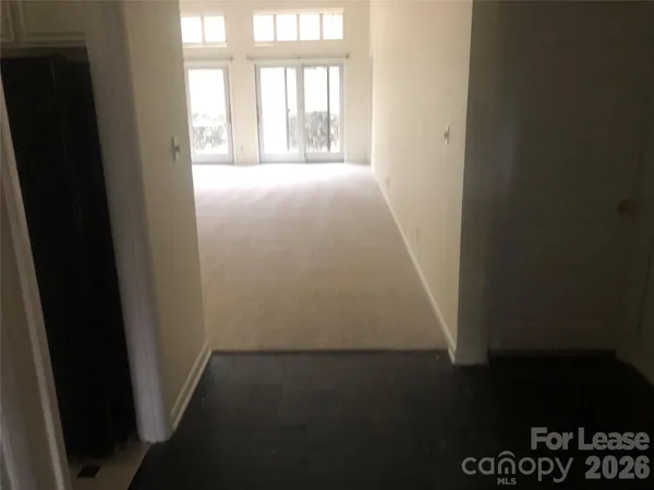 a view of empty room with windows