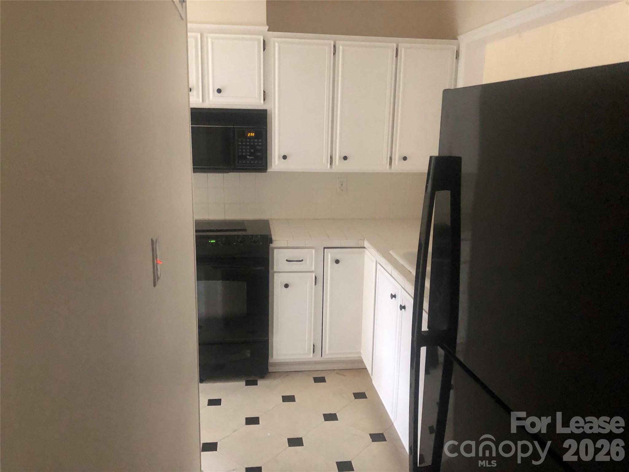43 Old Post Road Clover, SC 29710 - Photo 6 of 12 a view of a kitchen with refrigerator and cabinets