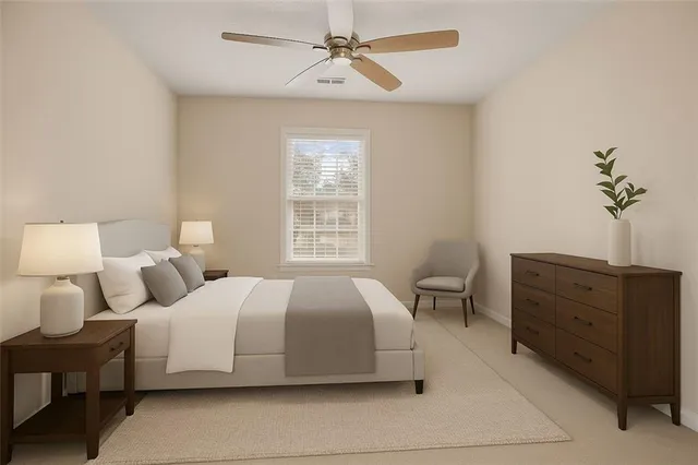 a bedroom with bed and window